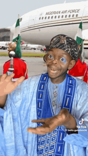 A Man In Front Of A Nigerian Air Force Plane GIF