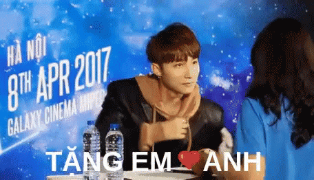 A Man In Front Of A Sign That Says 8Th Apr 2017 GIF