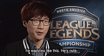 A Man In Front Of A Sign That Says North America League Legends Championship GIF
