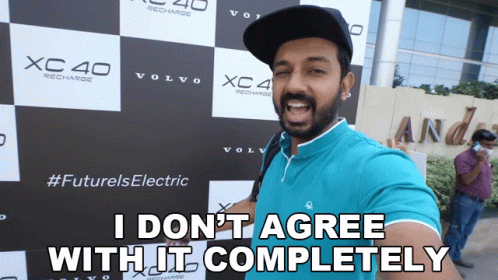 A Man In Front Of A Sign That Says Xc40 Recharge GIF