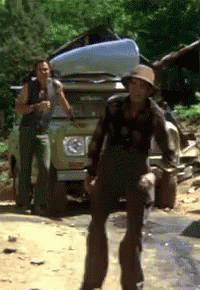 Man In Overalls And Hat In Front Of Jeep GIF
