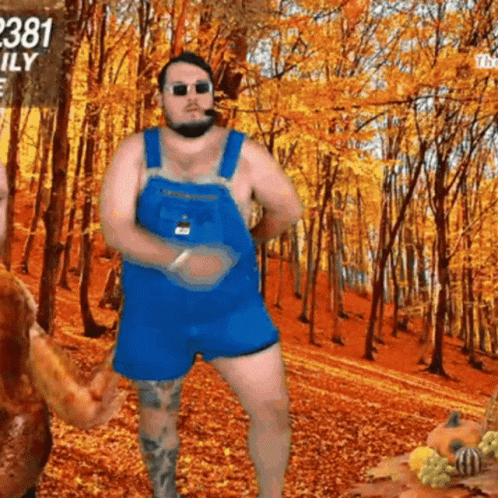 A Man In Overalls Is Dancing In Front Of A Sign That Says 2381 Family GIF