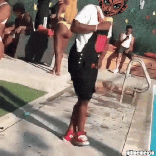 A Man In Overalls Is Standing In Front Of A Pool With A Cartoon Character On His Head GIF
