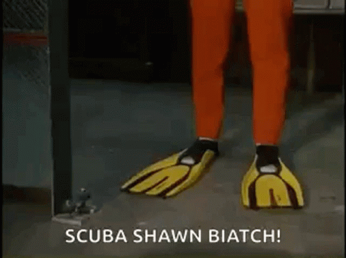 A Man In Red Pants And Yellow Gloves Says Scuba Shawn Biatch GIF