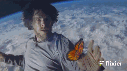 A Man In Space With The Word Flixier On The Bottom Left GIF