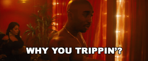 A Man Is Asking Why You Trippin ' On A Red Background GIF