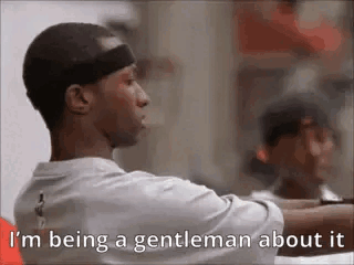 A Man Is Being A Gentleman About It While Wearing A Hat . GIF