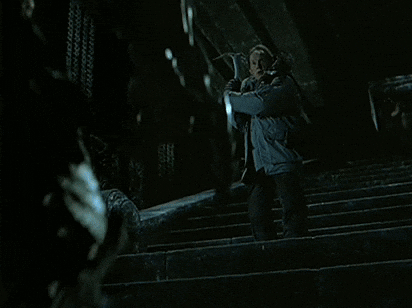 A Man Is Being Attacked By A Predator In A Movie Scene GIF