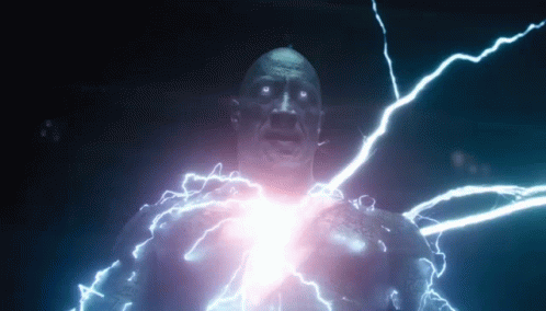 A Man Is Being Struck By Lightning While Standing In A Dark Room . GIF