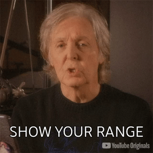 A Man Is Blowing A Kiss With The Caption Show Your Range GIF