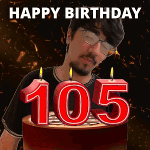 A Man Is Blowing Out Candles On A Birthday Cake With The Number 105 On It GIF