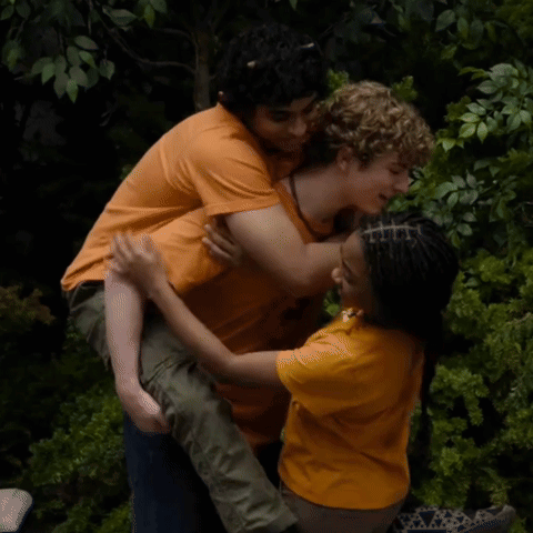A Man Is Carrying A Girl On His Shoulders GIF