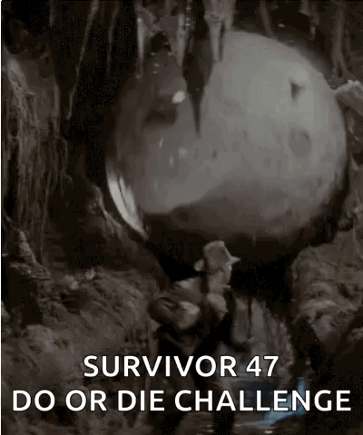 A Man Is Carrying A Large Rock In A Cave With The Words Survivor 47 Do Or Die Challenge On The Bottom . GIF