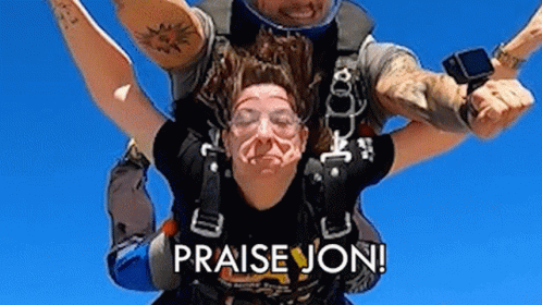A Man Is Carrying A Woman In The Air With The Words `` Praise Jon '' On The Bottom . GIF