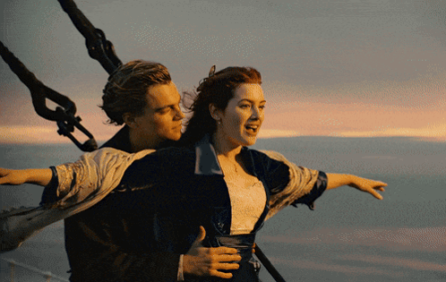 A Man Is Carrying A Woman On His Back In The Water GIF