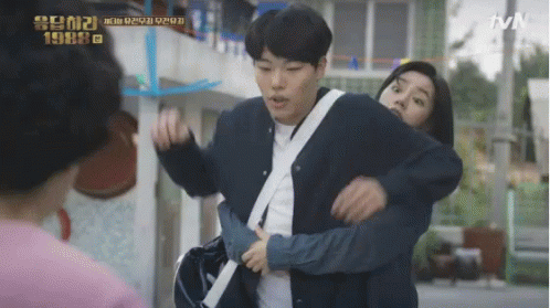 A Man Is Carrying A Woman On His Shoulders In A Tvn Show GIF