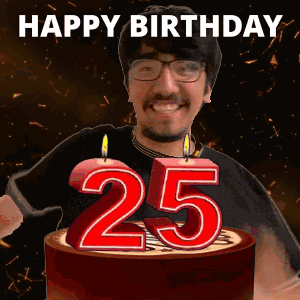 A Man Is Celebrating His 25Th Birthday By Blowing Out Candles On A Cake GIF