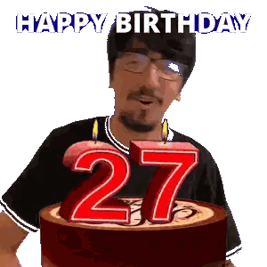 a man is celebrating his 27th birthday by blowing out candles on a cake