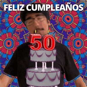 A Man Is Celebrating His 50Th Birthday With A Cake And Candles On It GIF