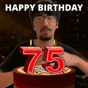 A Man Is Celebrating His 75Th Birthday By Blowing Out A Candle GIF