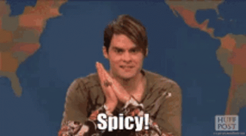A Man Is Clapping His Hands And Saying Spicy In Front Of A Map Of The World GIF