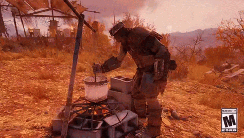 A Man Is Cooking Food On A Stove In The Desert . GIF