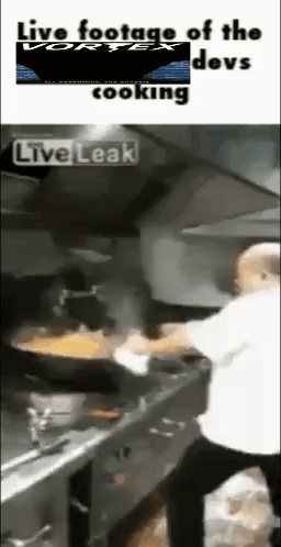 A Man Is Cooking In A Kitchen With The Words Live Footage Of The Devs Cooking On The Bottom GIF