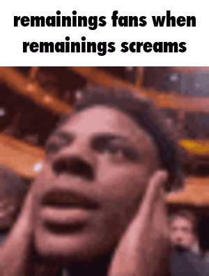 A Man Is Covering His Ears With His Hands While Screaming In Front Of A Crowd . GIF