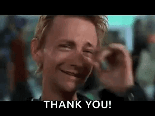 A Man Is Crying While Holding His Nose And Saying Thank You . GIF