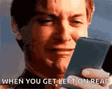 A Man Is Crying While Looking At A Cell Phone And Says `` When You Get Left On Read '' . GIF