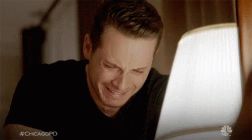 A Man Is Crying While Looking At A Laptop Screen With The Hashtag #Chicagopd On It GIF