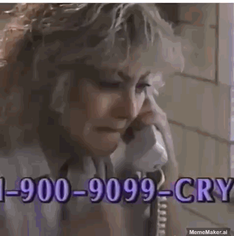 A Man Is Crying While Talking On A Phone With A Phone Number . GIF