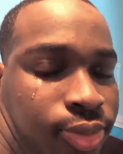 A Man Is Crying With A Tear Coming Out Of His Eye . GIF