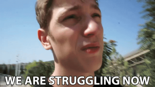 A Man Is Crying With The Words " We Are Struggling Now " Above Him GIF