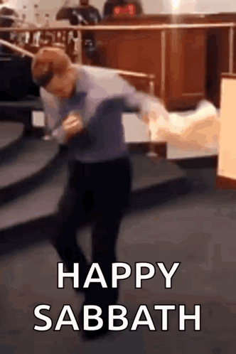 A Man Is Dancing In A Church With The Words `` Happy Sabbath '' Above Him . GIF