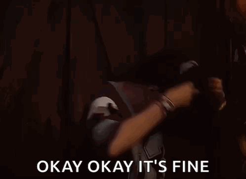 A Man Is Dancing In A Dark Room With The Words `` Okay Okay It 'S Fine '' Written On The Screen . GIF