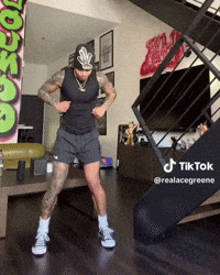 Man Dancing In Living Room With TikTok Sign GIF