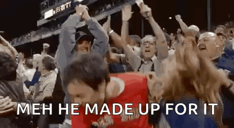 A Man Is Dancing In Front Of A Crowd Of People With The Words `` Meh He Made Up For It '' Written On The Bottom . GIF