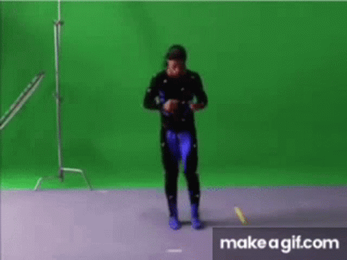 a man is dancing in front of a green screen ..