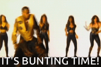 A Man Is Dancing In Front Of A Group Of Women With The Words It 'S Bunting Time Written Below Him GIF
