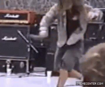 a man is dancing in front of a marshall amplifier .