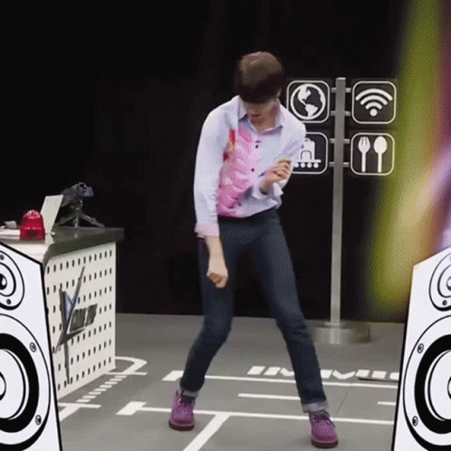 A Man Is Dancing In Front Of A Sign That Says ' Wifi ' On It GIF