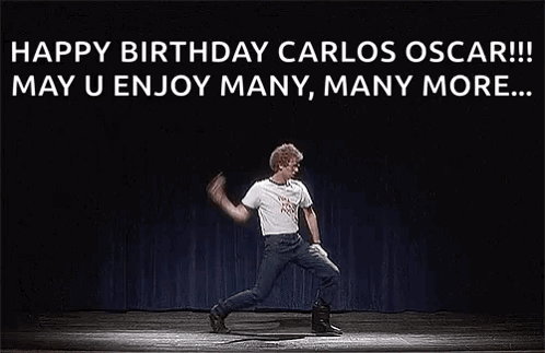 A Man Is Dancing On A Stage In Front Of A Black Background . GIF