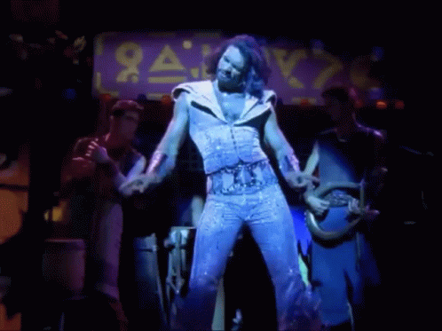 Man Dancing On Stage With Sale Sign GIF