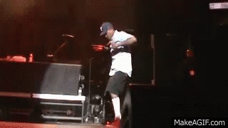 A Man Is Dancing On A Stage With Makeagif.com Written On The Bottom Of The Screen GIF