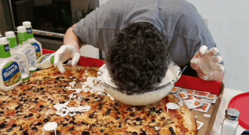 a man is dipping his head in ranch dressing