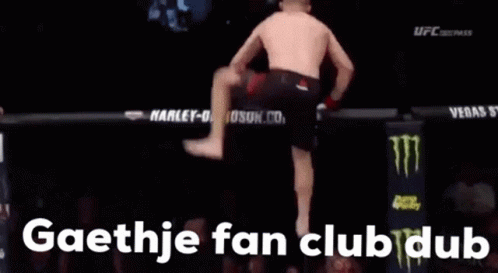 A Man Is Doing A Handstand In A Boxing Ring With The Words Gaethje Fan Club Dub In The Corner GIF