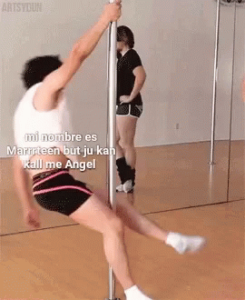 A Man Is Doing A Pole Dance In Front Of A Mirror With The Caption Mi Nombre Es Marriteen But Ju Kan Kill Me Angel GIF