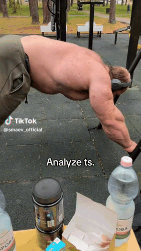 A Man Is Doing Push Ups In A Park With A Caption That Says Analyze Ts. GIF