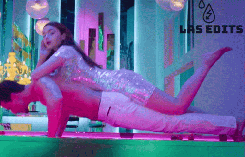 A Man Is Doing Push Ups With A Woman On His Back And The Words Las Edits Are On The Bottom GIF